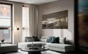 Modern living room with a grey sofa, round coffee table, and minimalist décor, showing how to decorate a small apartment elegantly on a limited budget.